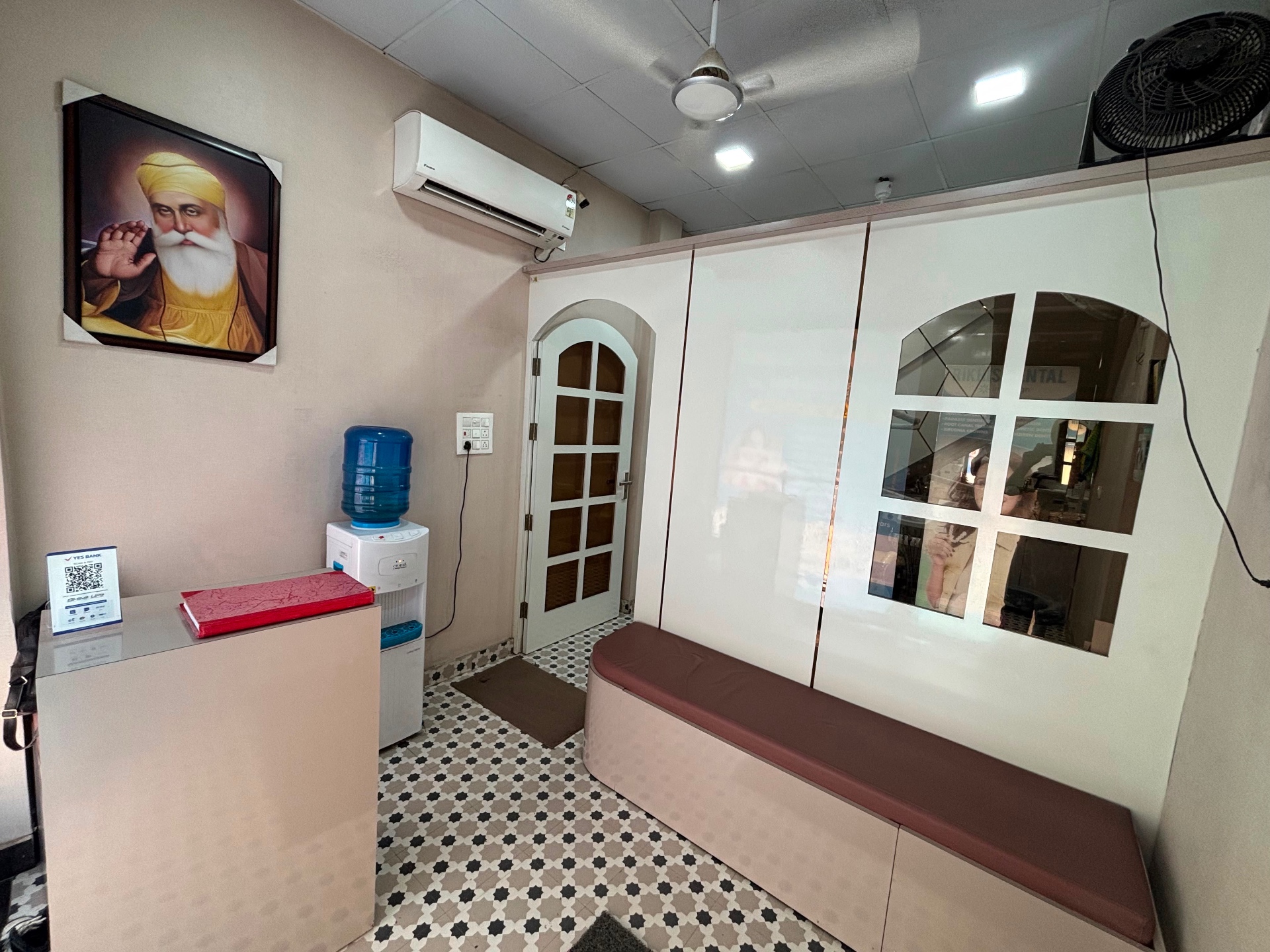 Clean reception and patient waiting area at Rikhi's Dental