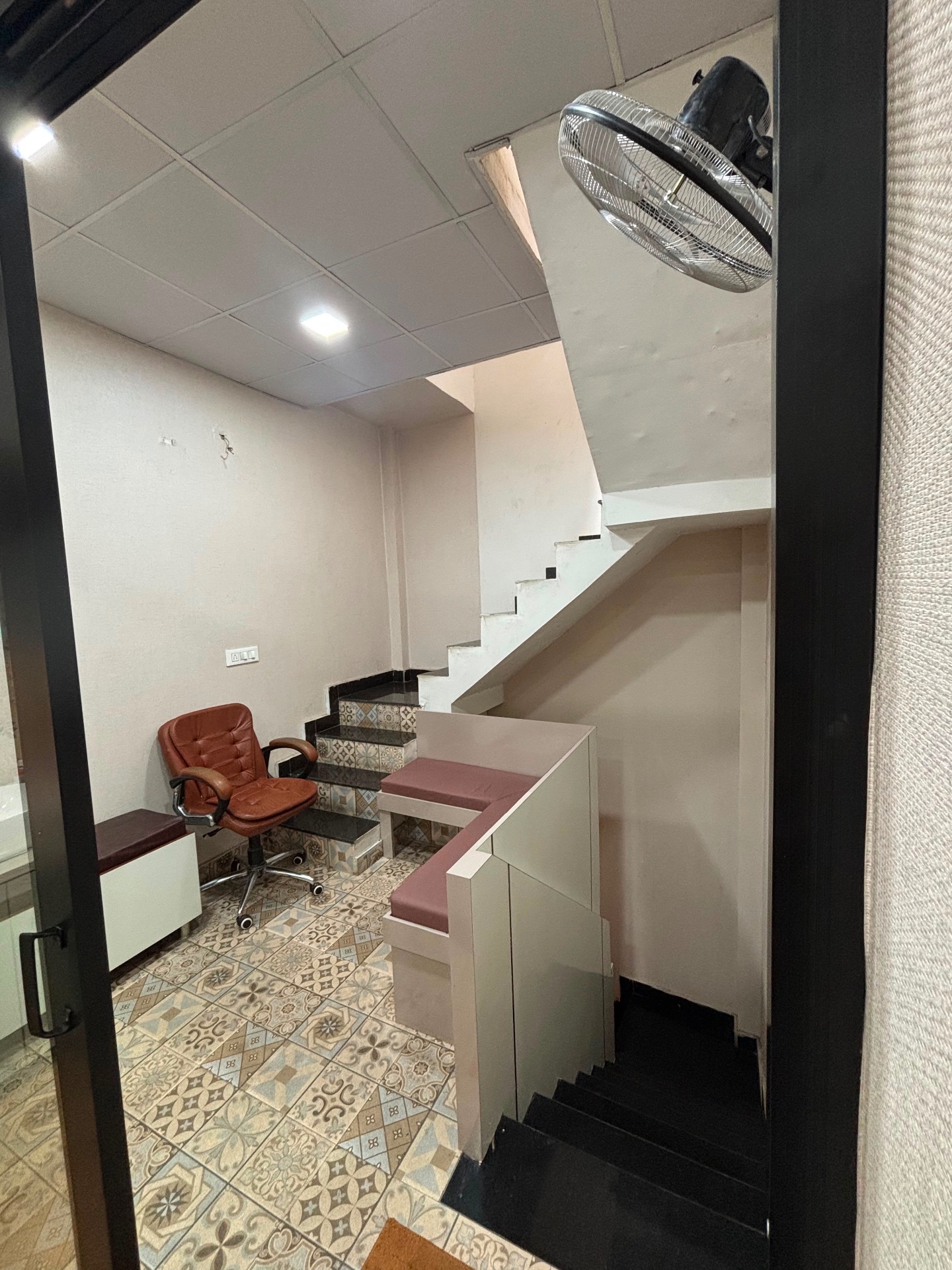 Additional seating and stair area inside the clinic