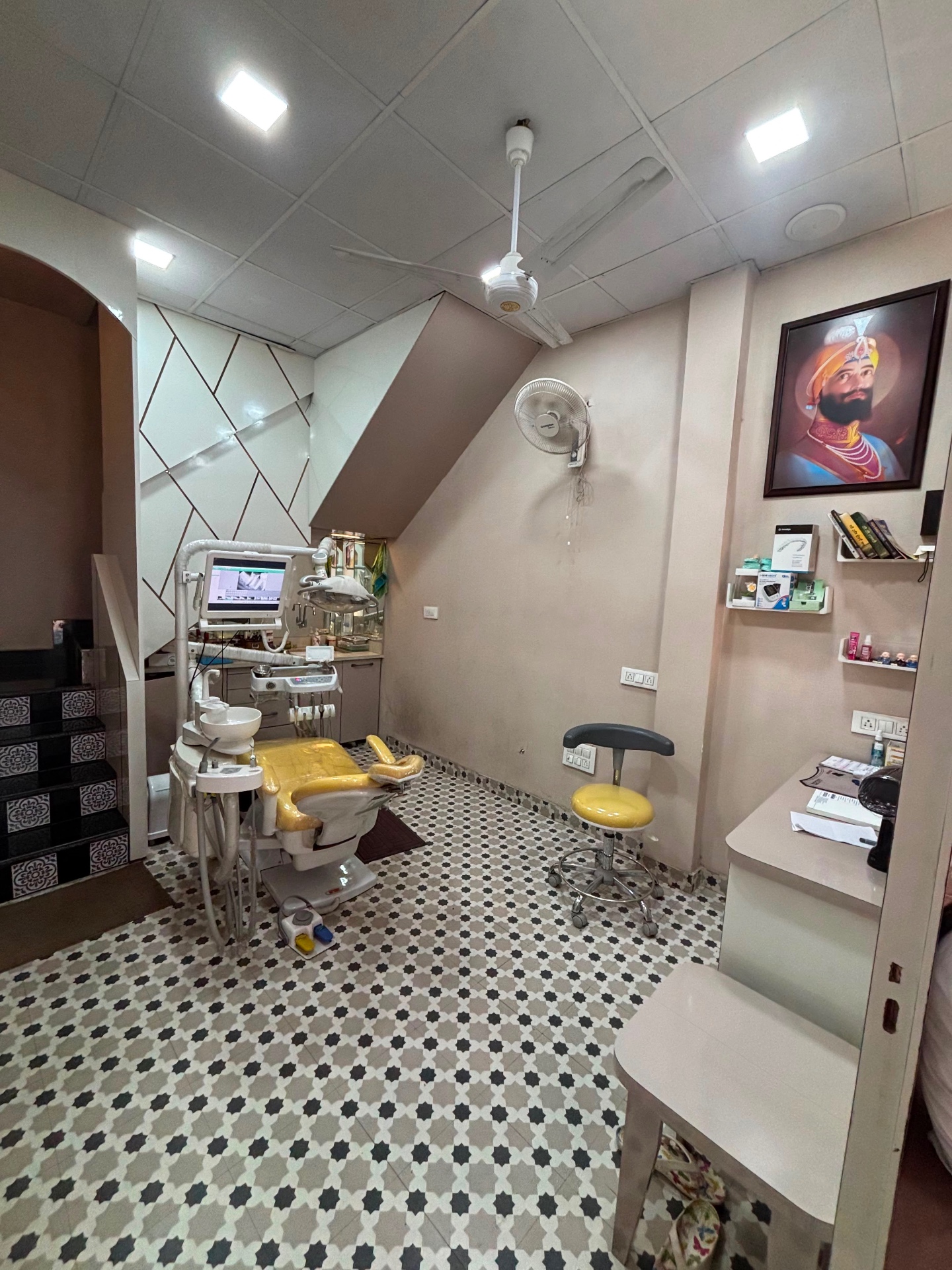 Spacious orthodontic treatment room with yellow dental chair